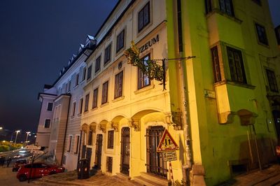 Residential building against sky at night