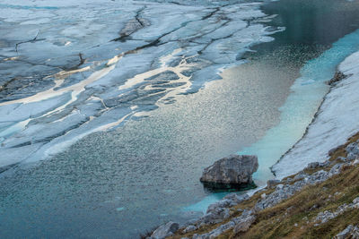High angle view of frozen sea shore