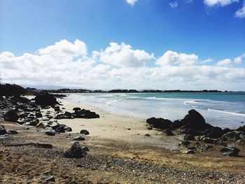 Scenic view of sea against cloudy sky