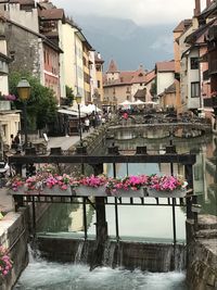 View of canal amidst buildings in city