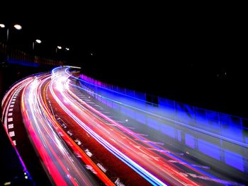 High angle view of light trails on road at night