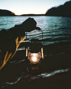 Close-up of hand holding a lantern