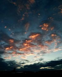 Low angle view of silhouette building against sky during sunset