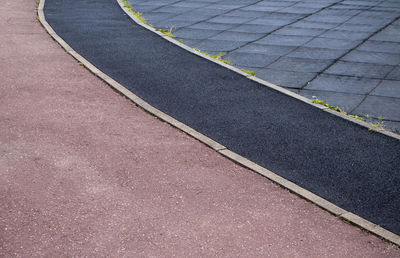 Close-up of a part of a sports stadium with markings for a treadmill