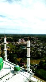 High angle view of city by building against sky