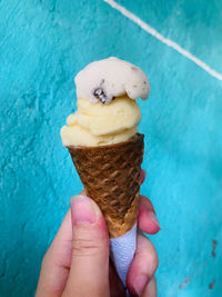 Cropped image of hand holding ice cream cone