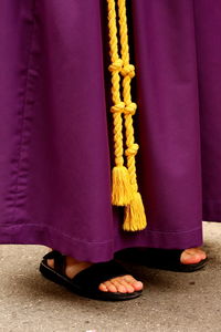 Low section of person standing on road