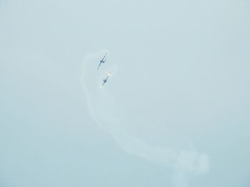 Low angle view of airplane flying in sky