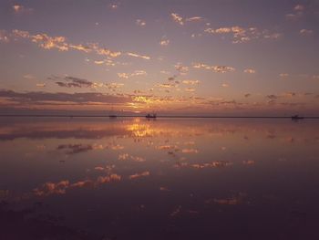 Scenic view of sea against sky at sunset