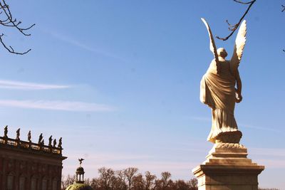 Low angle view of statue against sky