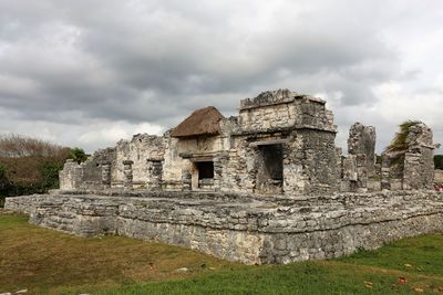 Old ruin building against cloudy sky