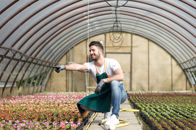 Full length of man holding flowers