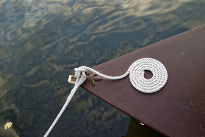 Rope over lake on metal