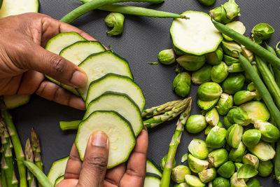 High angle view of hand holding fruits