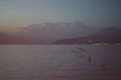 Scenic view of sea against sky at dusk