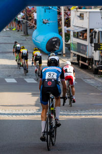 People riding bicycle on road