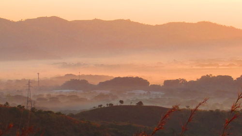 Scenic view of mountains at sunset