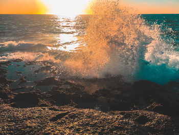 Aerial view of sea against sky during sunset