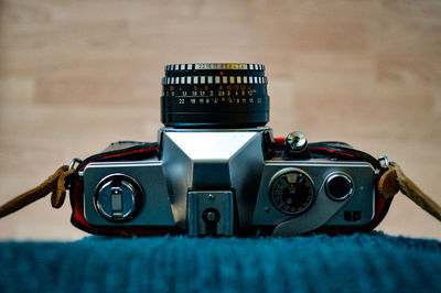 Close-up of old-fashioned camera on rug