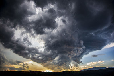 Scenic view of dramatic sky over landscape