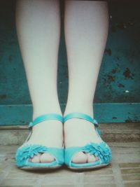 Close-up of shoes on wooden floor