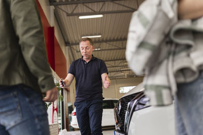 Customers in car dealership office