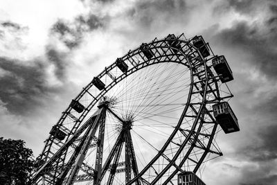 Low angle view of ferris wheel against sky