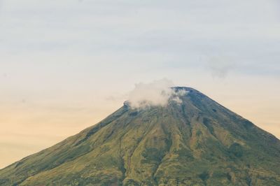 Scenic view of volcanic mountain against sky