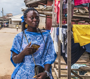 Young woman looking at market stall