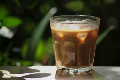 Close-up of tea in glass on table