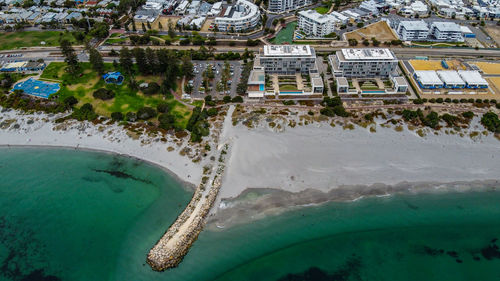 Aerial view of townscape by coastline