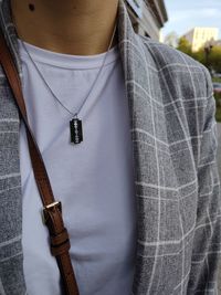 Close-up of man holding umbrella