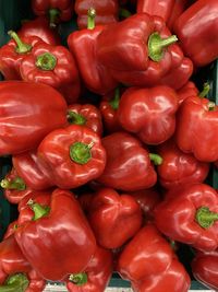 Full frame shot of red bell peppers for sale in market