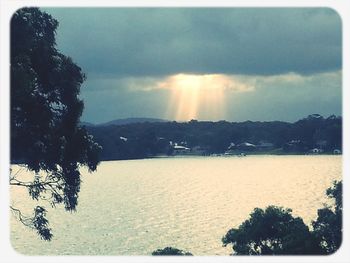 Scenic view of mountains against cloudy sky