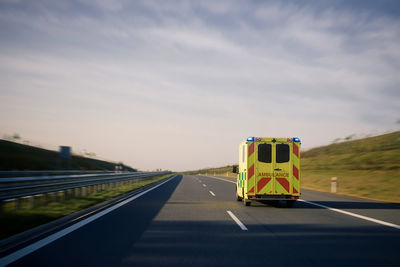 Fast moving ambulance car of emergency medical service on highway. 