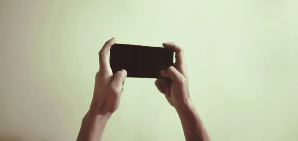 Midsection of woman using mobile phone