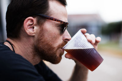 Close-up of man drinking coffee