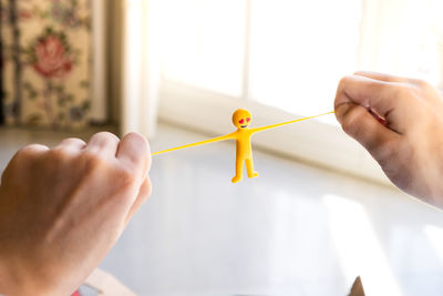 Cropped hand of woman holding gift