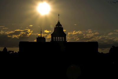 Silhouette of building against sky during sunset