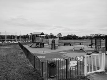 Built structure on field by building against sky