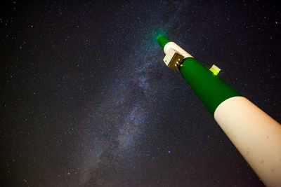 Close-up of illuminated smoking on table