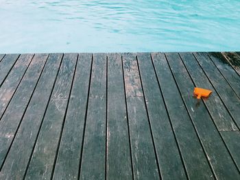 Close-up of pier over swimming pool