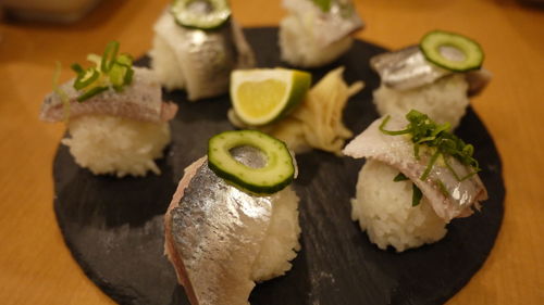 Close-up of sushi served on table