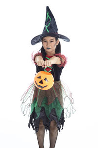 Portrait of girl wearing mask against white background