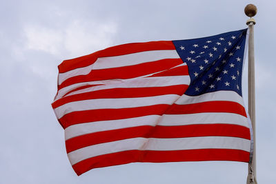 Low angle view of flag against sky