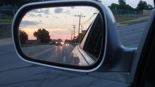 Reflection of sky on side-view mirror