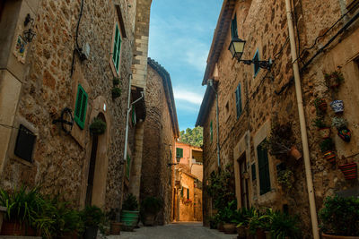 Narrow alley amidst old buildings in town