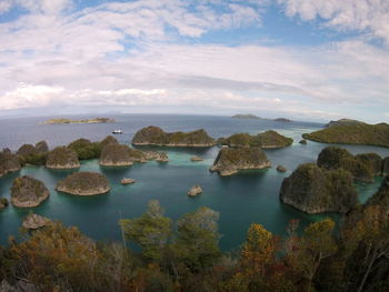 Scenic view of calm sea against cloudy sky