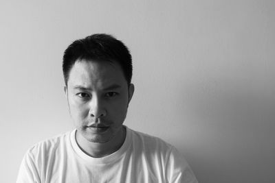 Portrait of man against white background