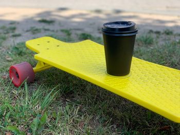 Close-up of yellow toy on field